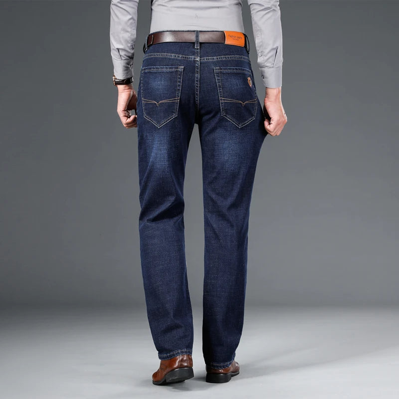 SHAN BAO 2026 autumn spring fitted straight stretch denim jeans classic style badge youth men's business casual jeans trousers